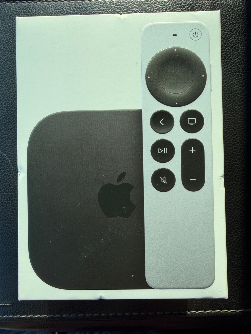 Apple TV 4K with Silver Remote and Black Streaming Box